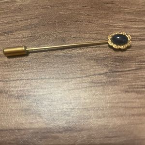 Black and gold hat pin